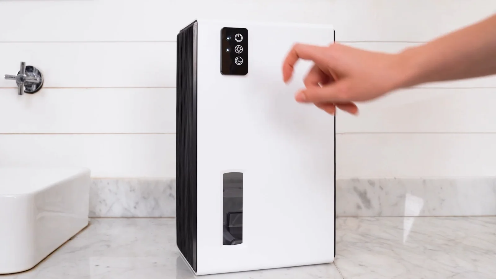 A hand starting a white NineSky CT2 with one touch