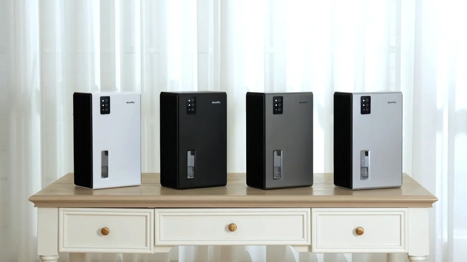 NineSky CT2 dehumidifiers lined up in several finishes