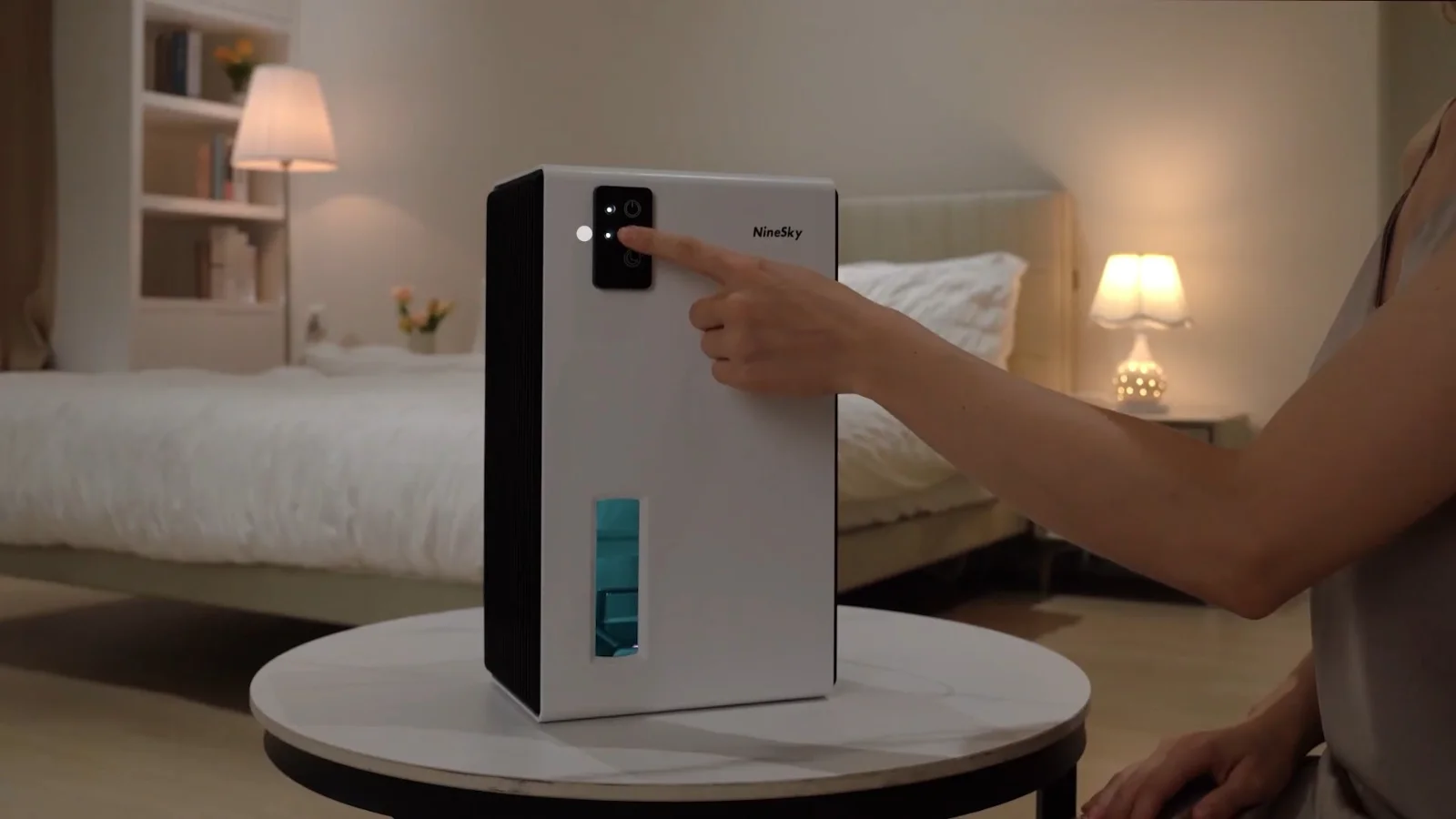 A NineSky CT2 on a bedside table in the evening, ambient light on